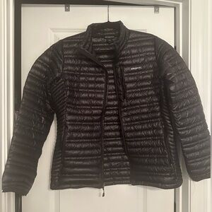 Black packable puffer coat.